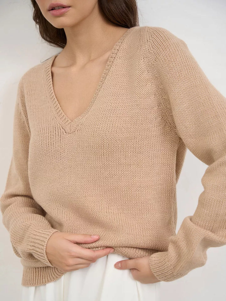 Warm knitted jumper with a neckline