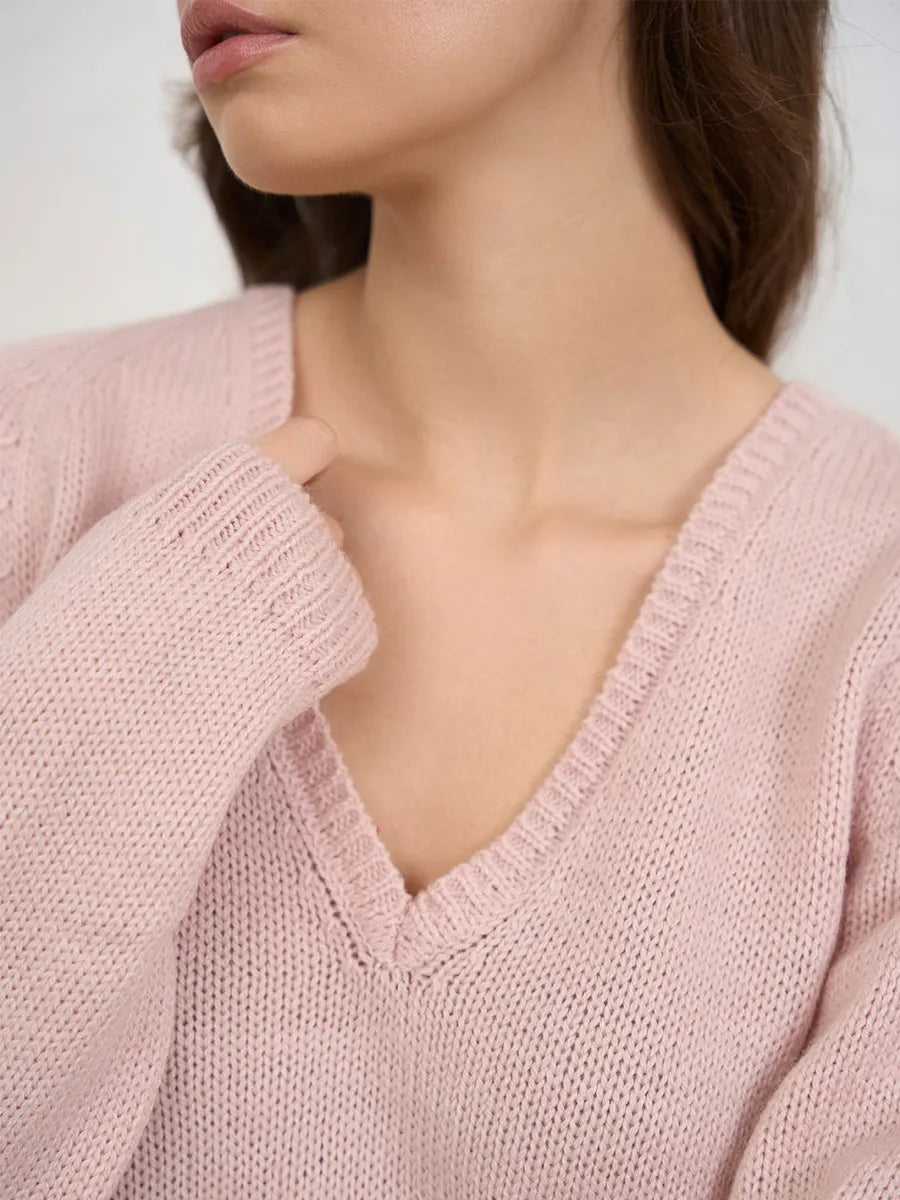 Warm knitted jumper with a neckline