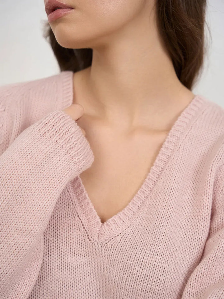 Warm knitted jumper with a neckline