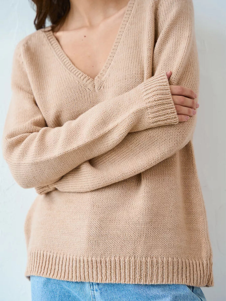 Warm knitted jumper with a neckline