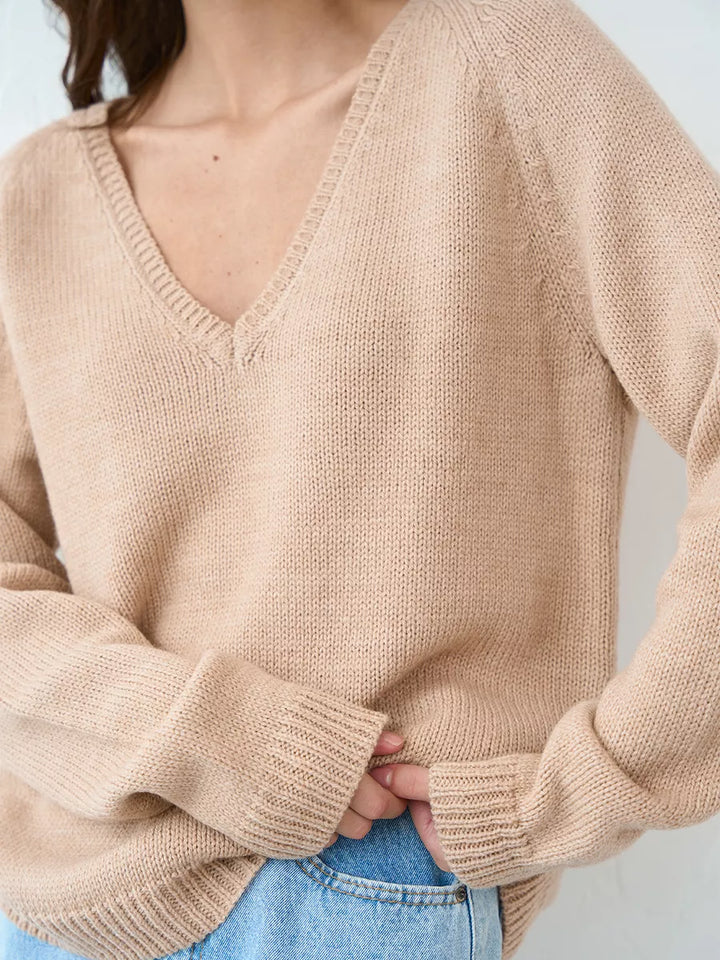 Warm knitted jumper with a neckline